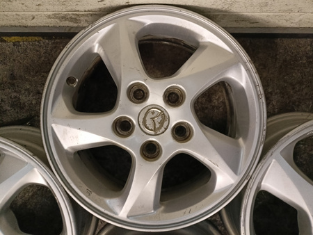 Oryginał felgi 15cali Mazda 3 5 Axela MPV Premacy KIA Mitsubishi