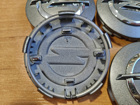 Oryginał dekielki zaślepki kołpaczki kapsle Opel 13347294 grafitowe