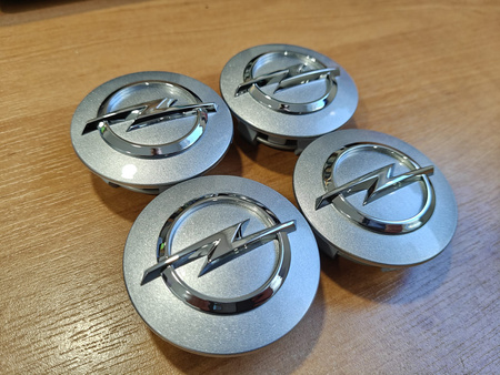 Oryginał dekielki dekle zaślepki kołpaczki Opel 13276166 srebrne