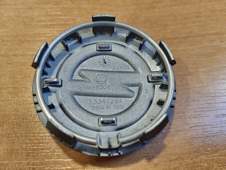 Oryginał dekielek zaślepka kołpaczek dekiel Opel 13347294 grafitowy