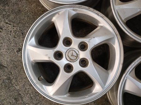 Oryginał felgi 15cali Mazda 3 5 Axela MPV Premacy KIA Mitsubishi